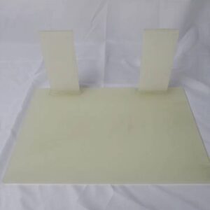 Cream plastic mounting plate with two tabs