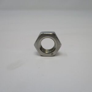stainless steel hex nut on white surface