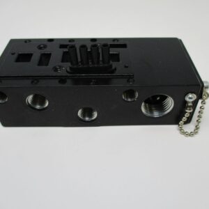 Black pneumatic valve manifold with threaded ports