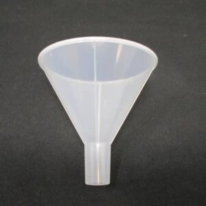Small translucent plastic funnel on black