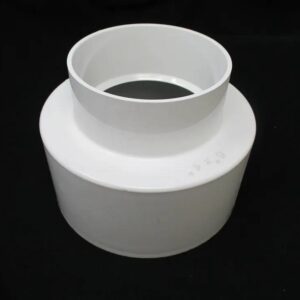 White PVC reducer fitting on black background
