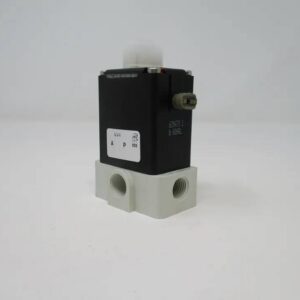 Black solenoid mounted on white plastic manifold