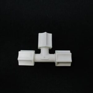 Three-way white plastic T-connector fitting