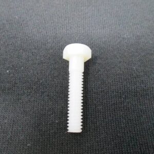 White nylon hex screw on fabric background