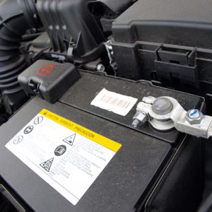 A car battery inside an automobile.