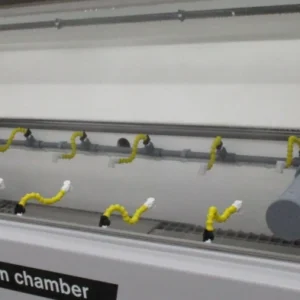 Interior of Auto Technology X Series Size 40 NC cyclic corrosion chamber showing oscillating spray bars and exposure zone for cyclic corrosion testing.