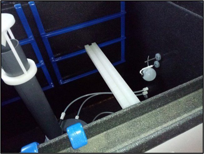 6 degree slotted polypropylene panel support bars installed in corrosion chamber rack for aerospace and NADCAP corrosion testing programs